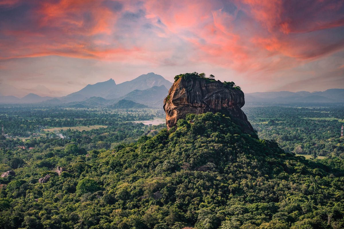 (Selective focus) Spectacular view of the Lion rock surrounded by green rich vegetation. Picture taken from Pidurangala Rock in Sigiriya, Sri Lanka.